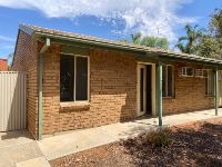 Outside of a brick single storey house