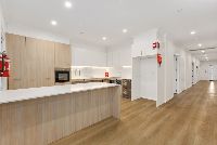 96d29b53 7cf0-4c8b-bec7-47913e63554f-lg-Erskine---Kitchen-Hallway-LR-No-Logo